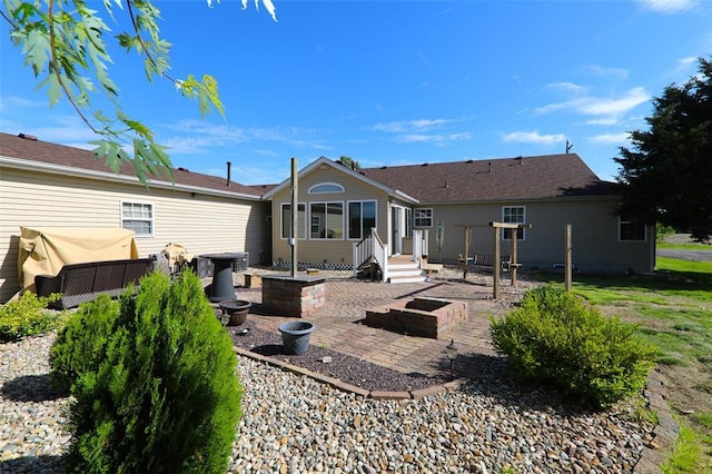 rear view of house with a patio
