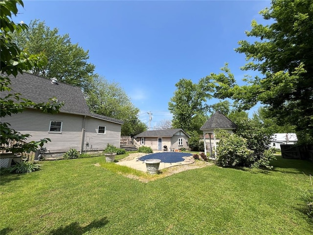 view of green lawn with a patio and a deck