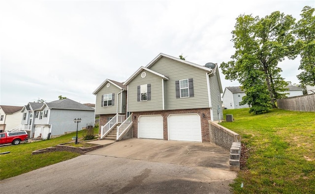 23529 Restore Rd, Waynesville, MO 65583 - view of front of home featuring brick siding, an attached garage, a front lawn, driveway, and stairs