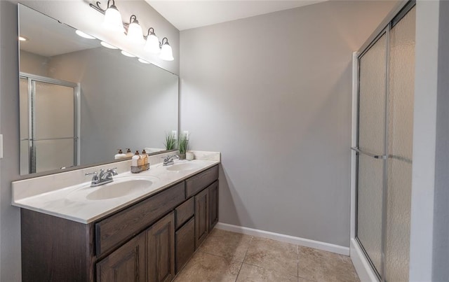 23529 Restore Rd, Waynesville, MO 65583 - bathroom featuring an enclosed shower, baseboards, double vanity, and tile patterned floors