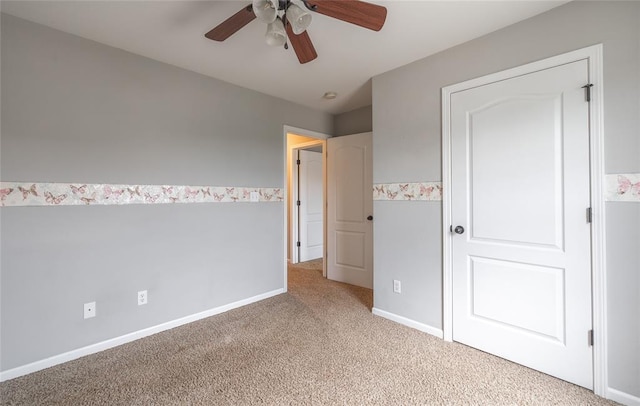 23529 Restore Rd, Waynesville, MO 65583 - unfurnished bedroom featuring light carpet, ceiling fan, and baseboards