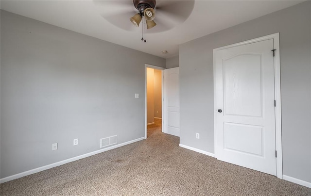 23529 Restore Rd, Waynesville, MO 65583 - unfurnished bedroom with carpet floors, baseboards, and ceiling fan