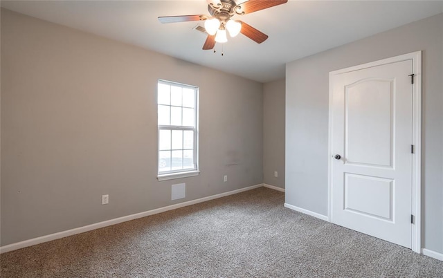 23529 Restore Rd, Waynesville, MO 65583 - carpeted spare room featuring a ceiling fan and baseboards