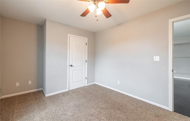 23529 Restore Rd, Waynesville, MO 65583 - unfurnished bedroom with carpet, baseboards, and a ceiling fan
