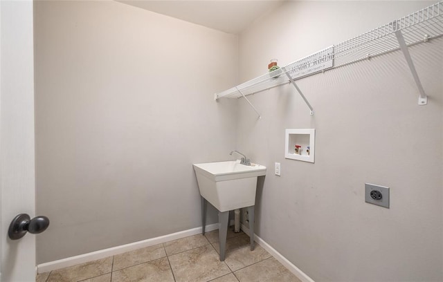 23529 Restore Rd, Waynesville, MO 65583 - clothes washing area with hookup for an electric dryer, washer hookup, light tile patterned floors, and baseboards