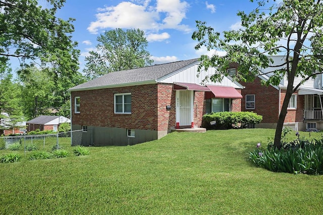 view of front of property featuring brick siding and a shingled roof