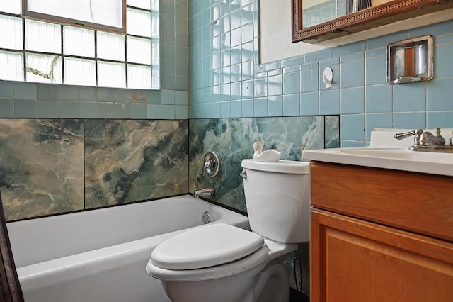 8909 Tutwiler Ave, Berkeley, MO 63134 - bathroom with backsplash, toilet, vanity, and tile walls