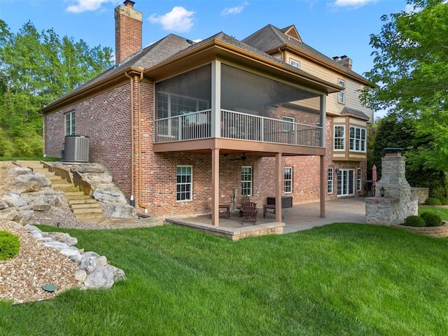 230 Merlot Ln, Saint Albans, MO 63073 - rear view of property featuring a chimney, brick siding, a patio area, and central AC unit