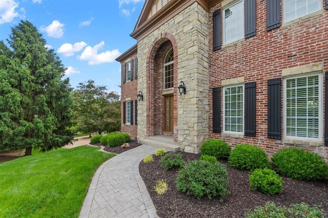 230 Merlot Ln, Saint Albans, MO 63073 - doorway to property featuring brick siding and a yard