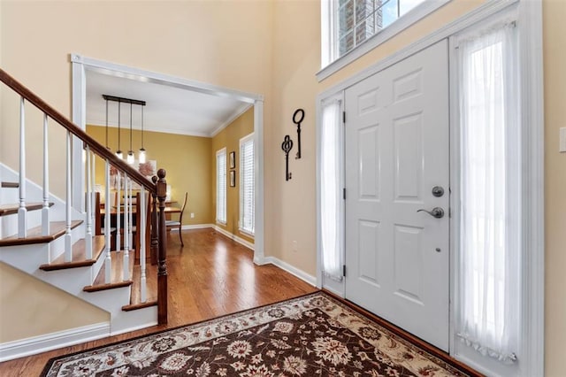 230 Merlot Ln, Saint Albans, MO 63073 - entrance foyer featuring ornamental molding, wood finished floors, stairway, and baseboards