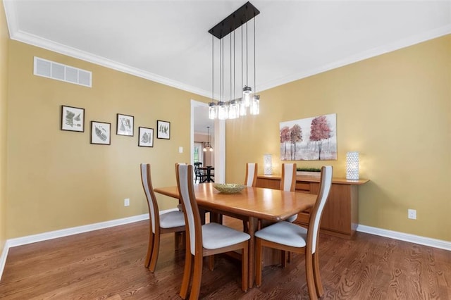 230 Merlot Ln, Saint Albans, MO 63073 - dining space featuring wood finished floors, baseboards, and ornamental molding