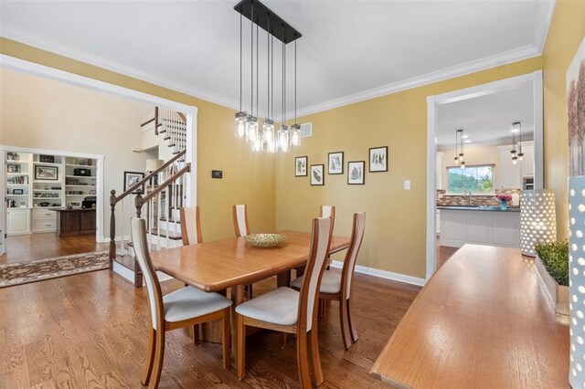 230 Merlot Ln, Saint Albans, MO 63073 - dining room featuring stairs, dark wood-style floors, crown molding, and baseboards