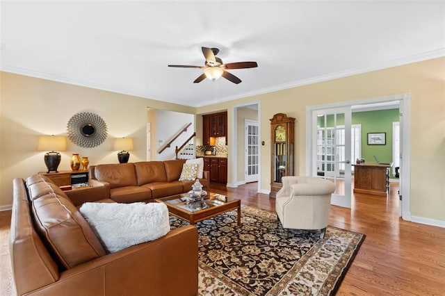 230 Merlot Ln, Saint Albans, MO 63073 - living room with stairs, ornamental molding, a ceiling fan, light wood finished floors, and baseboards