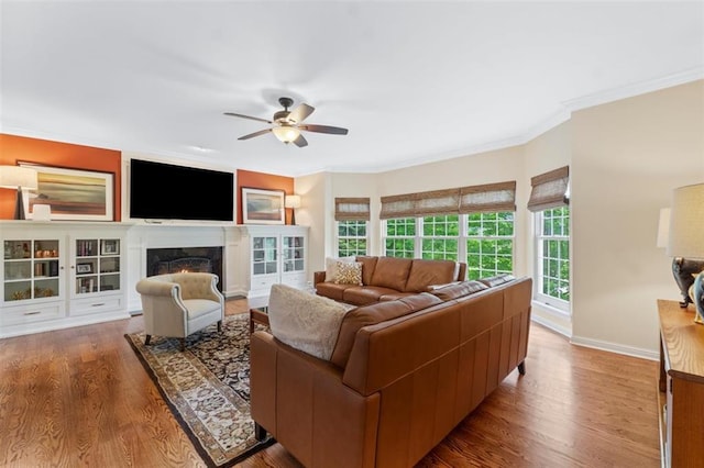 230 Merlot Ln, Saint Albans, MO 63073 - living room with wood finished floors, a ceiling fan, crown molding, baseboards, and a high end fireplace
