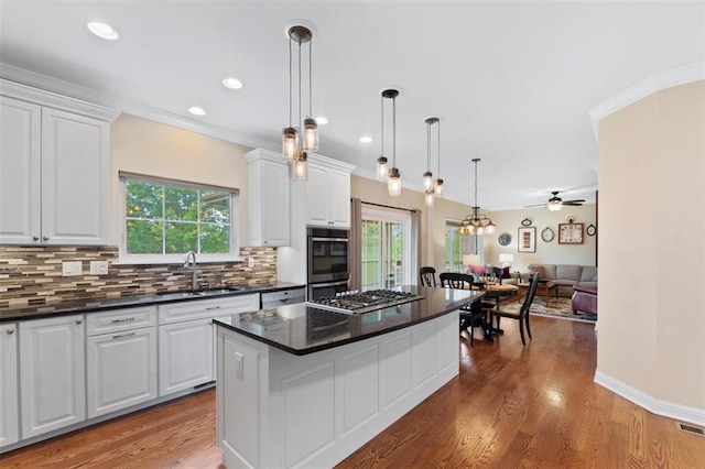 230 Merlot Ln, Saint Albans, MO 63073 - kitchen with open floor plan, plenty of natural light, white cabinetry, decorative backsplash, and recessed lighting