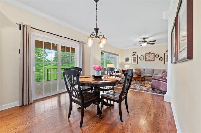 230 Merlot Ln, Saint Albans, MO 63073 - dining space with ornamental molding, baseboards, wood finished floors, a chandelier, and ceiling fan