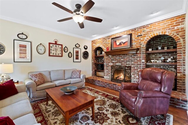 230 Merlot Ln, Saint Albans, MO 63073 - living room featuring a fireplace, a ceiling fan, crown molding, and wood finished floors