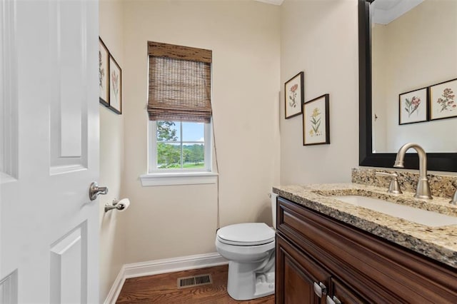 230 Merlot Ln, Saint Albans, MO 63073 - half bathroom with vanity, toilet, baseboards, and wood finished floors