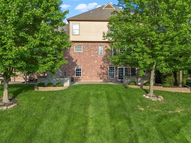 230 Merlot Ln, Saint Albans, MO 63073 - back of house with a lawn and brick siding