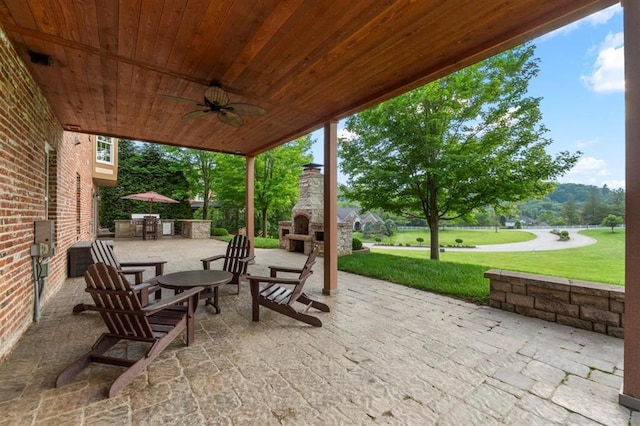230 Merlot Ln, Saint Albans, MO 63073 - view of patio / terrace with an outdoor stone fireplace and a ceiling fan
