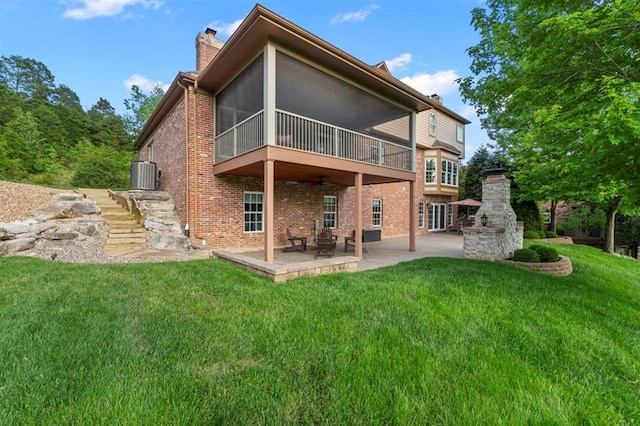 230 Merlot Ln, Saint Albans, MO 63073 - back of property featuring a chimney, brick siding, a patio area, central AC, and a yard