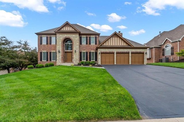 230 Merlot Ln, Saint Albans, MO 63073 - view of front of house featuring a front yard, a garage, and driveway