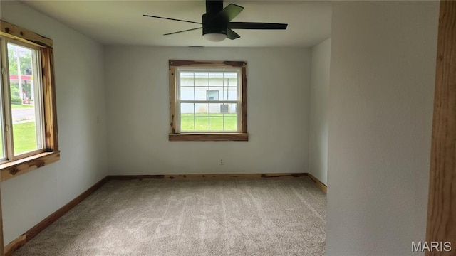 229 S Main St, Licking, MO 65542 - unfurnished room featuring healthy amount of natural light, carpet, and ceiling fan