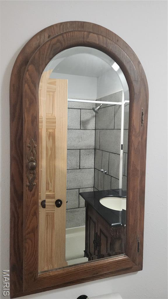 229 S Main St, Licking, MO 65542 - full bathroom with vanity and shower / tub combination