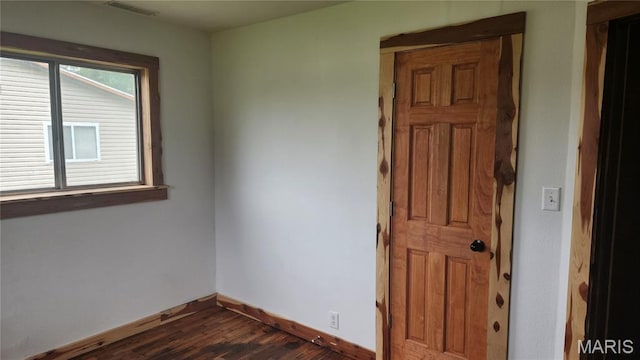 229 S Main St, Licking, MO 65542 - spare room featuring baseboards and dark wood finished floors