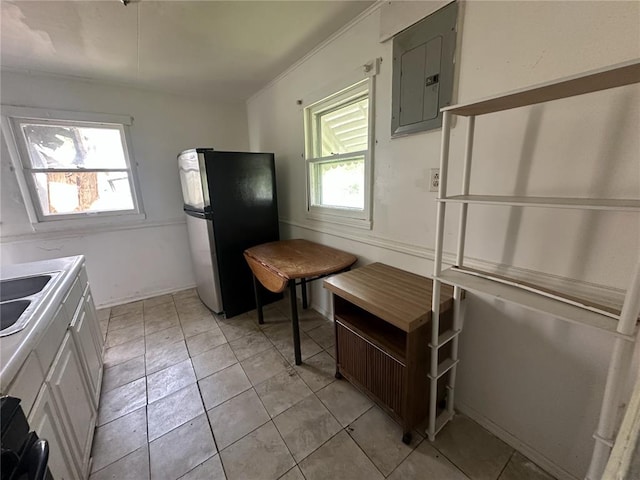 6501 Stratford Ave, Pine Lawn, MO 63120 - kitchen with freestanding refrigerator, electric panel, light countertops, and a sink