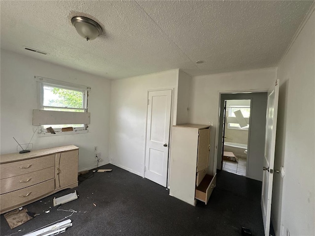 6501 Stratford Ave, Pine Lawn, MO 63120 - misc room with a textured ceiling