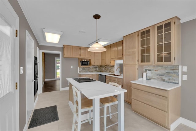 kitchen with a sink, appliances with stainless steel finishes, crown molding, decorative backsplash, and glass insert cabinets