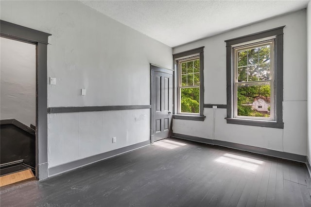 214 W Steins, Saint Louis, MO 63111 - unfurnished room featuring wood finished floors and a textured ceiling