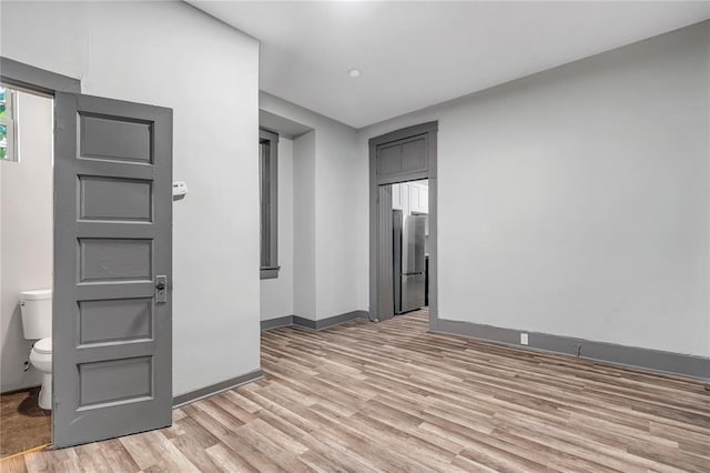 214 W Steins, Saint Louis, MO 63111 - spare room with light wood-type flooring and baseboards