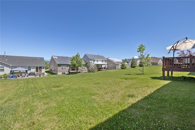 1051 Timber Creek Ln, Imperial, MO 63052 - view of grassy yard featuring a residential view and a wooden deck