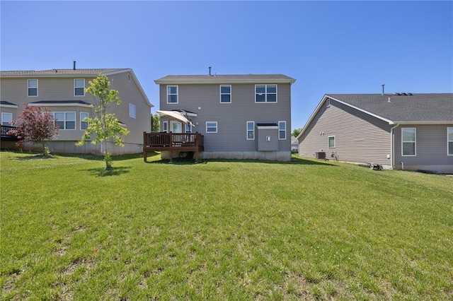 1051 Timber Creek Ln, Imperial, MO 63052 - back of property with a lawn, a wooden deck, and central air condition unit