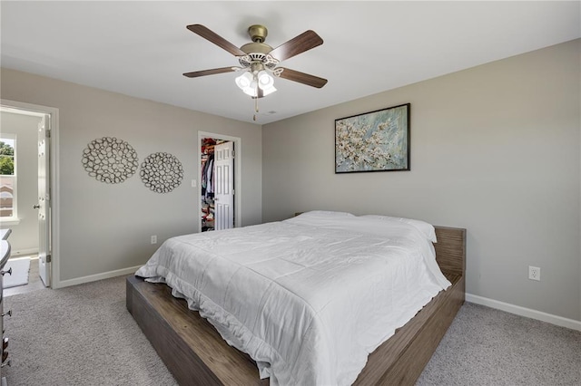 1051 Timber Creek Ln, Imperial, MO 63052 - carpeted bedroom with baseboards, a spacious closet, ceiling fan, a closet, and ensuite bath