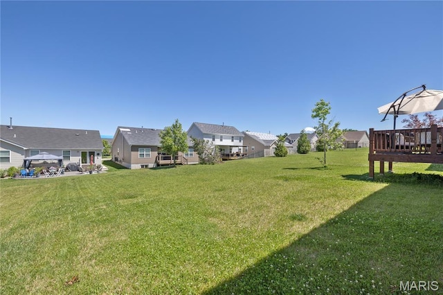 1051 Timber Creek Ln, Imperial, MO 63052 - view of grassy yard featuring a residential view and a deck