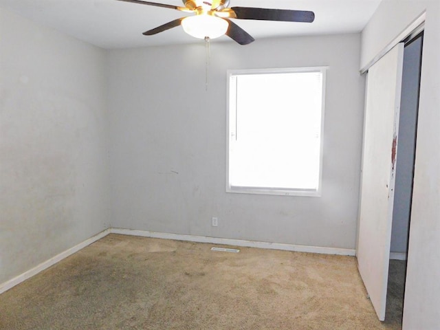unfurnished bedroom with carpet flooring, a closet, and baseboards