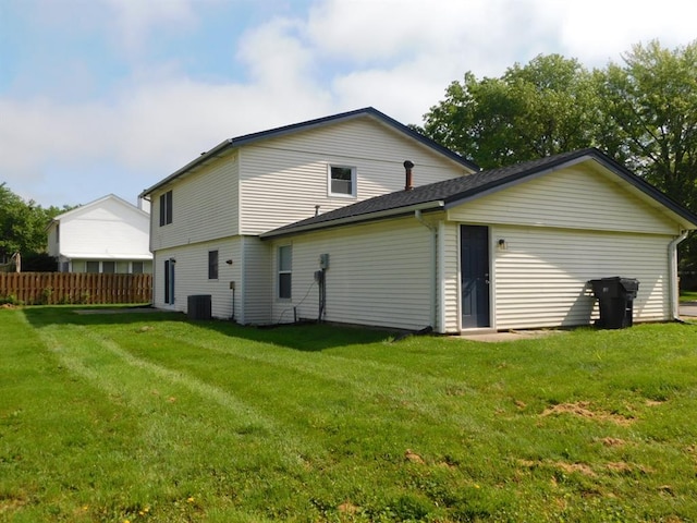 back of house featuring cooling unit