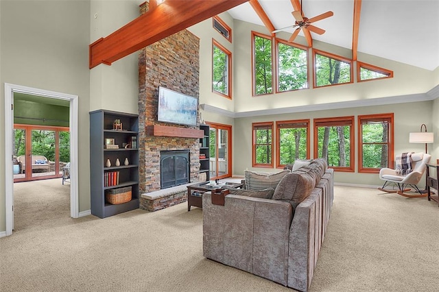 19072 Bear Trail Rd, Glencoe, MO 63038 - living area with high vaulted ceiling, carpet flooring, a stone fireplace, baseboards, and beamed ceiling