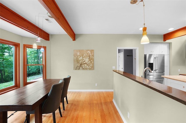19072 Bear Trail Rd, Glencoe, MO 63038 - dining space with baseboards, light wood-type flooring, and beam ceiling