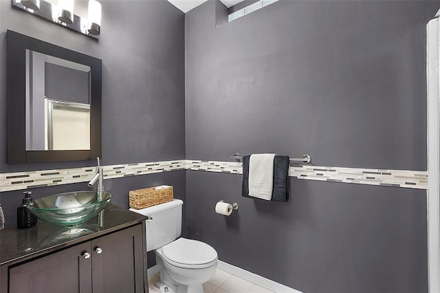 19072 Bear Trail Rd, Glencoe, MO 63038 - half bathroom featuring toilet, vanity, tile patterned floors, and baseboards