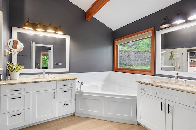 19072 Bear Trail Rd, Glencoe, MO 63038 - bathroom with two vanities, a bath, and wood finished floors