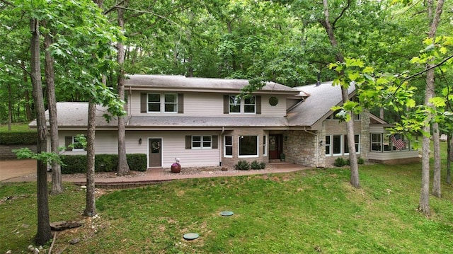 19072 Bear Trail Rd, Glencoe, MO 63038 - traditional-style house featuring a front lawn, stone siding, and a patio area