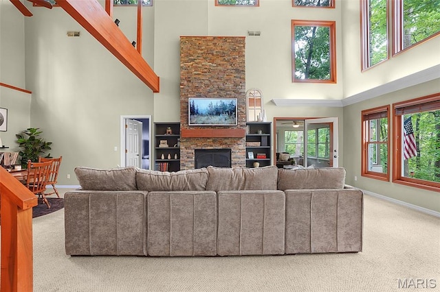 19072 Bear Trail Rd, Glencoe, MO 63038 - carpeted living room with a high ceiling, a fireplace, and ceiling fan