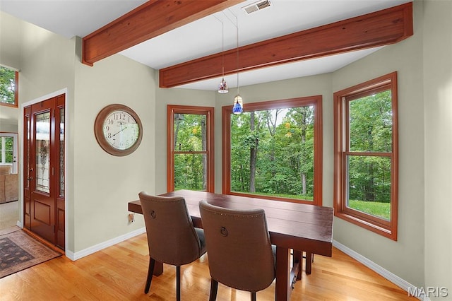 19072 Bear Trail Rd, Glencoe, MO 63038 - dining space featuring healthy amount of natural light, light wood-style floors, and beam ceiling