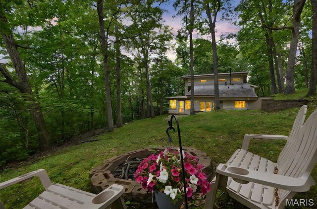 19072 Bear Trail Rd, Glencoe, MO 63038 - yard at dusk featuring a fire pit and a yard