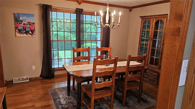 189 County Road 657, Cape Girardeau, MO 63701 - dining room with a chandelier, wood finished floors, crown molding, and baseboards