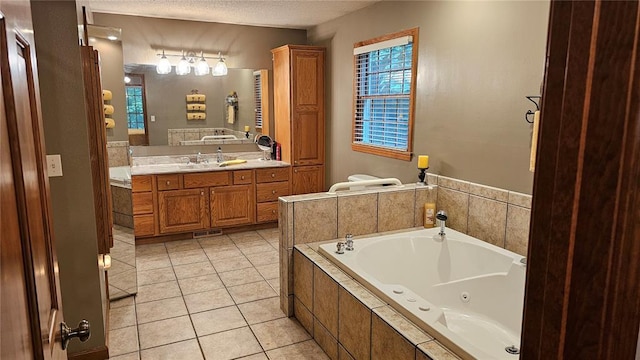 189 County Road 657, Cape Girardeau, MO 63701 - full bath with a whirlpool tub, vanity, tile patterned floors, and a textured ceiling